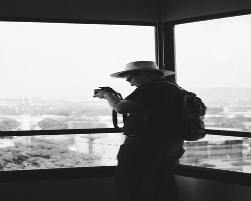 A person enjoying a calm morning coffee near a window