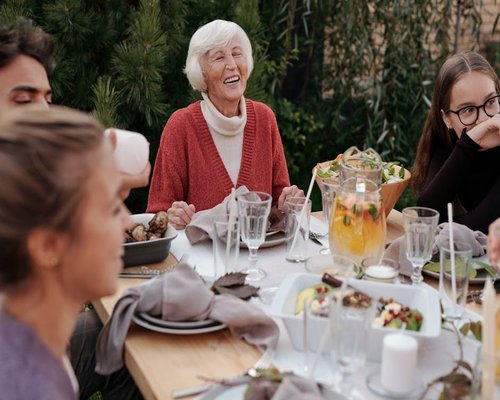 A family sitting together having a calm dinner without screens